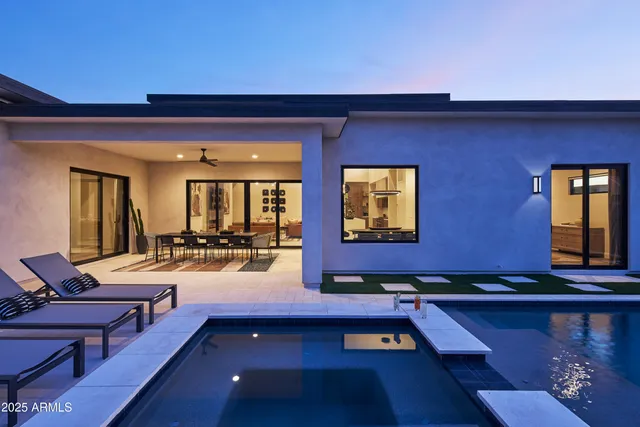 a view of swimming pool with outdoor seating