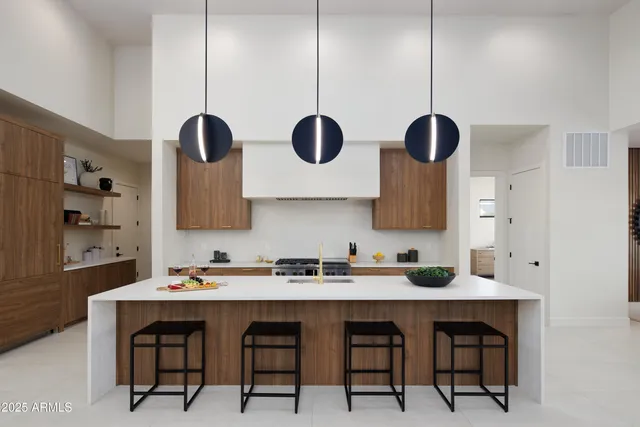 a kitchen with a stove a sink and a stove