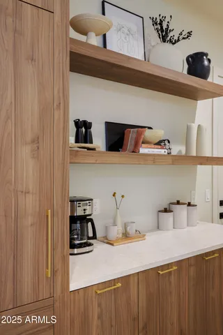 a kitchen with sink stove and cabinets
