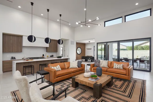 a living room with furniture a rug and a fireplace