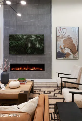 a living room with furniture ceiling fan and a couch