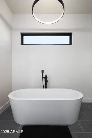 a spacious bathroom with a double vanity sink and a mirror