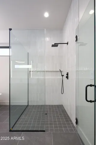 a bedroom with a bed and window with lamp