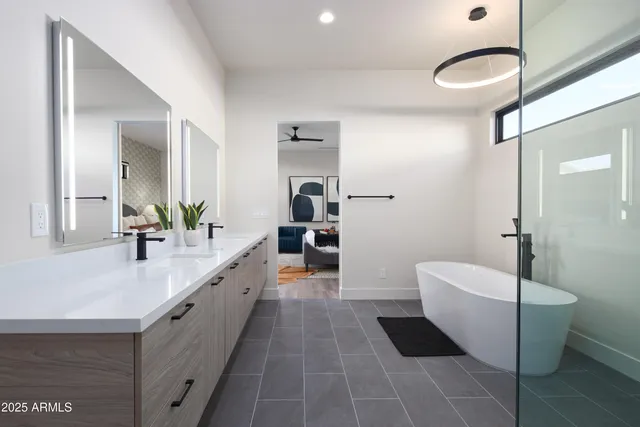 a bathroom with a double vanity sink and a mirror