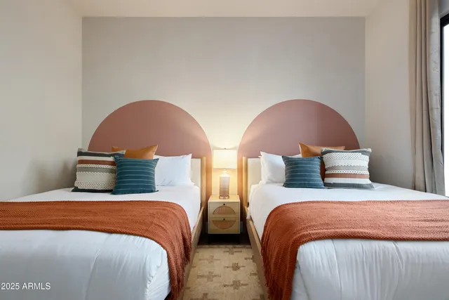 a bedroom with a bed and window