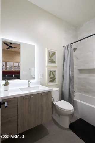 a bathroom with a sink a toilet and mirror