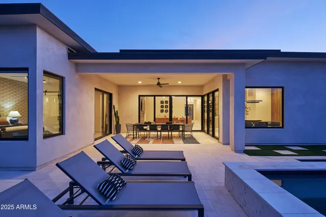 a view of swimming pool with seating space