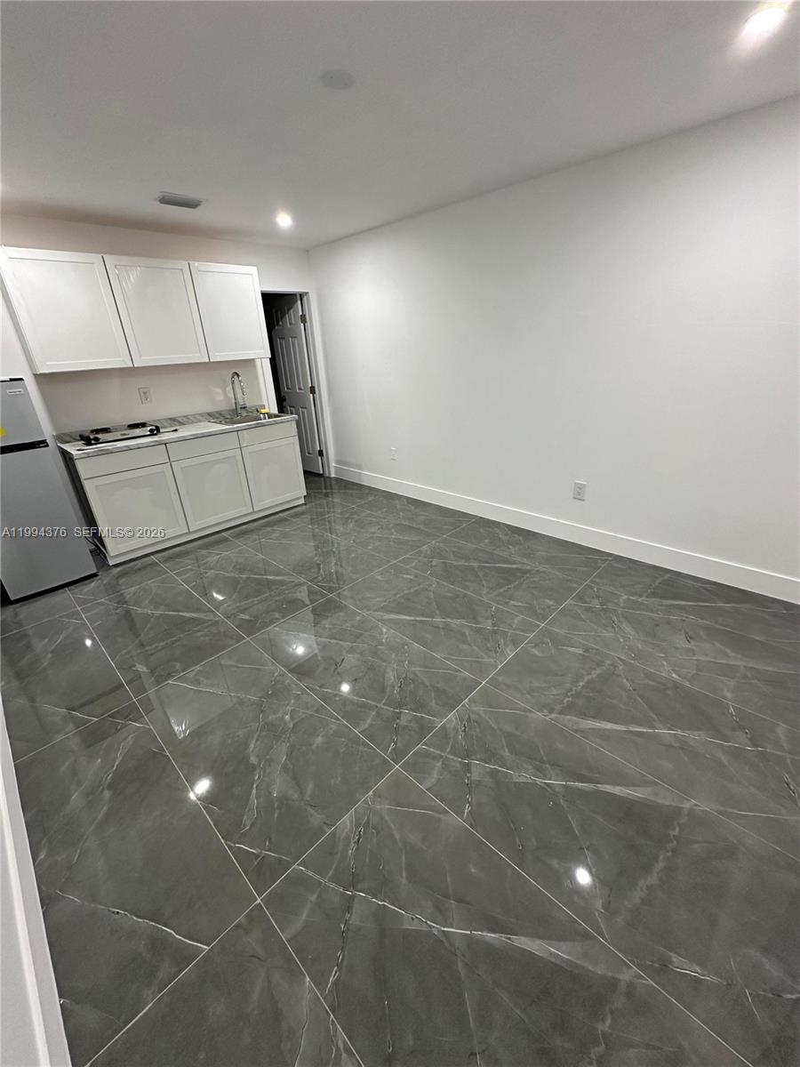 10825 Southwest 145th Place, Unit 2 Miami, FL 33186 - Photo 2 of 6 a view of an empty room