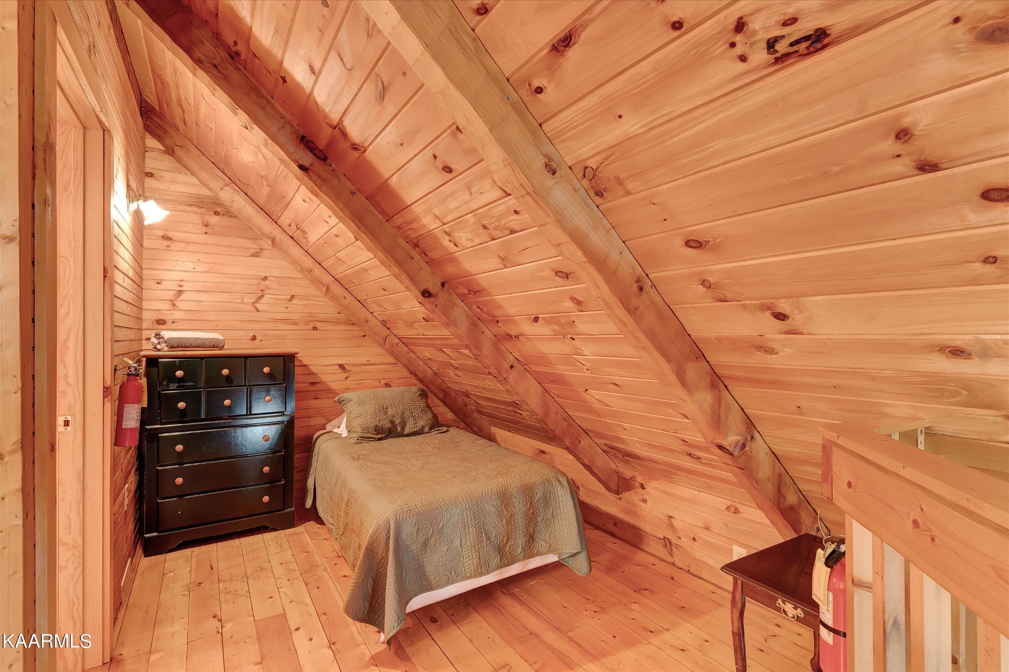 442 Hideaway Ridge Circle Sevierville, TN 37862 - Photo 17 of 40 a bed room with a bed and a chair