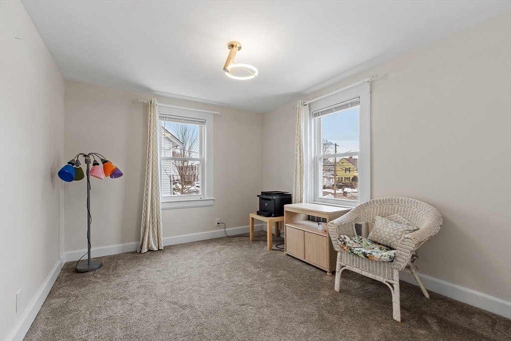53 Wallace Road Quincy, MA 02169 - Photo 19 of 28 a living room with furniture and a window