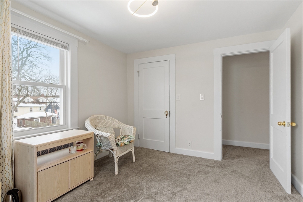 53 Wallace Road Quincy, MA 02169 - Photo 20 of 28 a view of a room that has a bed and a window in it