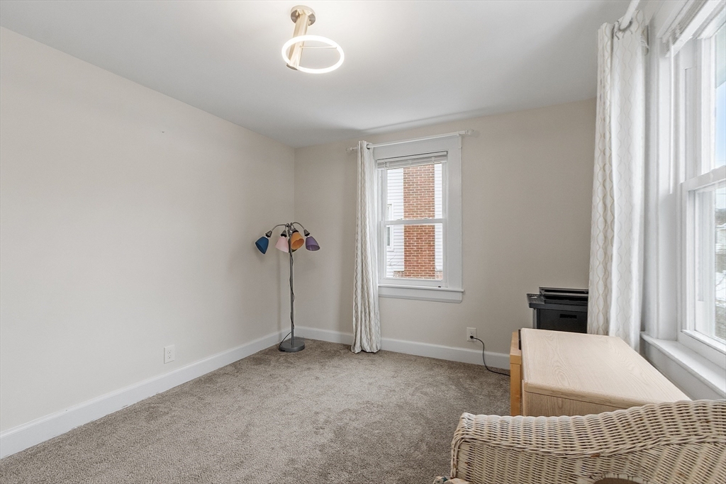 53 Wallace Road Quincy, MA 02169 - Photo 21 of 28 a living room with furniture and a window
