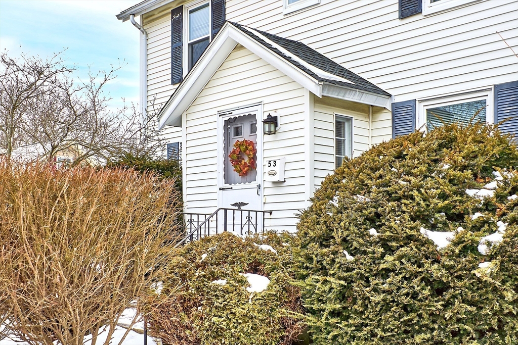 53 Wallace Road Quincy, MA 02169 - Photo 4 of 28 a view of a house with a tree