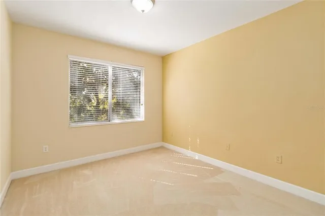 a bathroom with a tub a sink and mirror