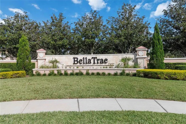 a view of a house with swimming pool and a yard