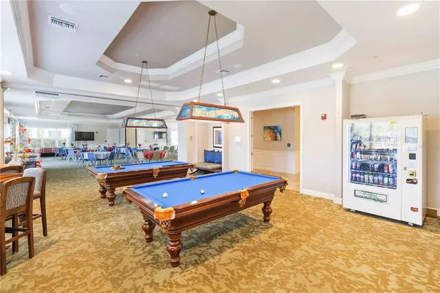 a view of a living room with hardwood floor and a large window