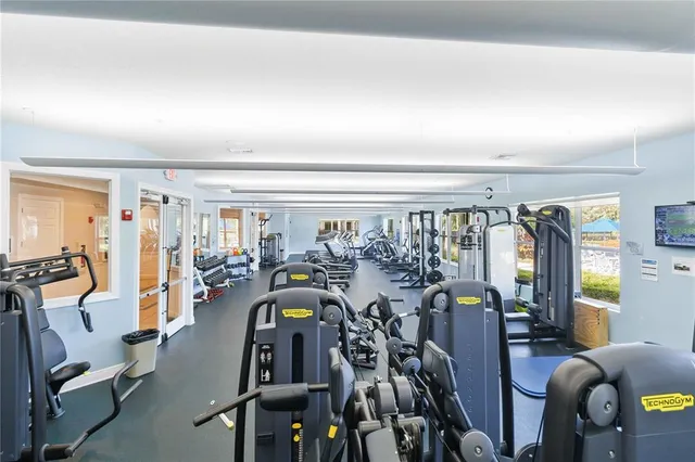 a view of swimming pool with outdoor seating and plants