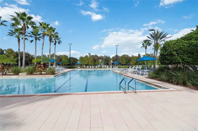 a view of a swimming pool with a patio