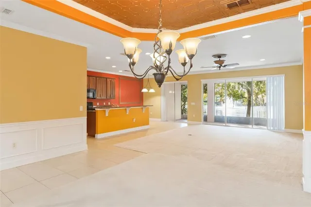 a view of a livingroom with furniture and a ceiling fan