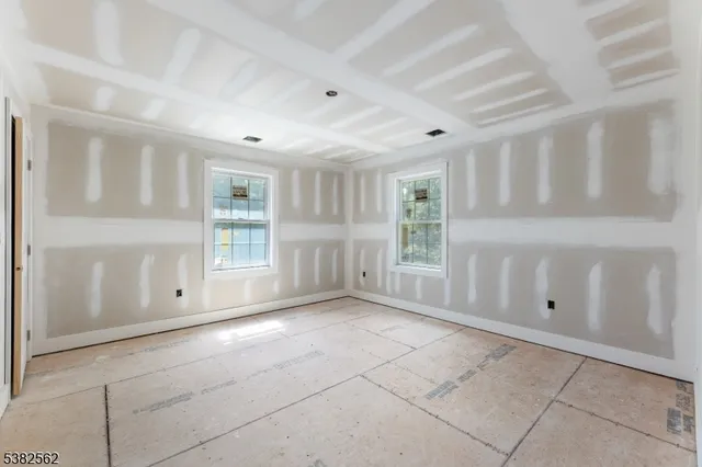 a bathroom with a sink and mirror with toilet