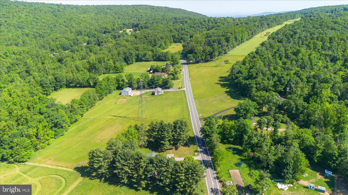 13806 Wolfsville Road Smithsburg, MD 21783 - Photo 34 of 35 an aerial view of residential houses with outdoor space and trees all around