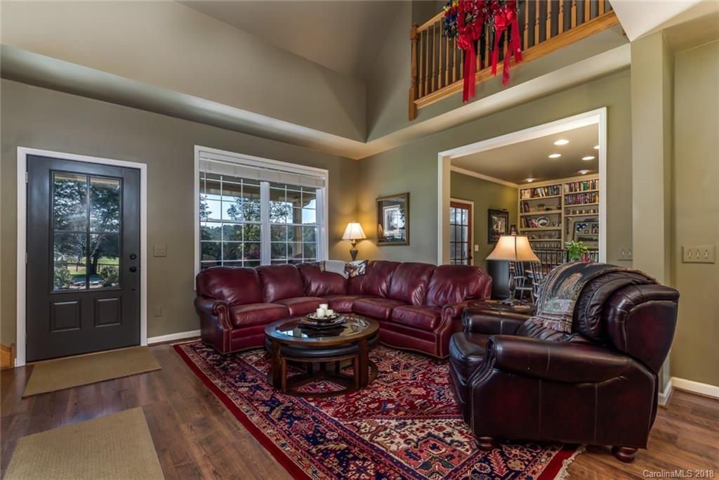 1588 McEntire Road Tryon, NC 28782 - Photo 2 of 27 a living room with furniture ceiling fan and a rug