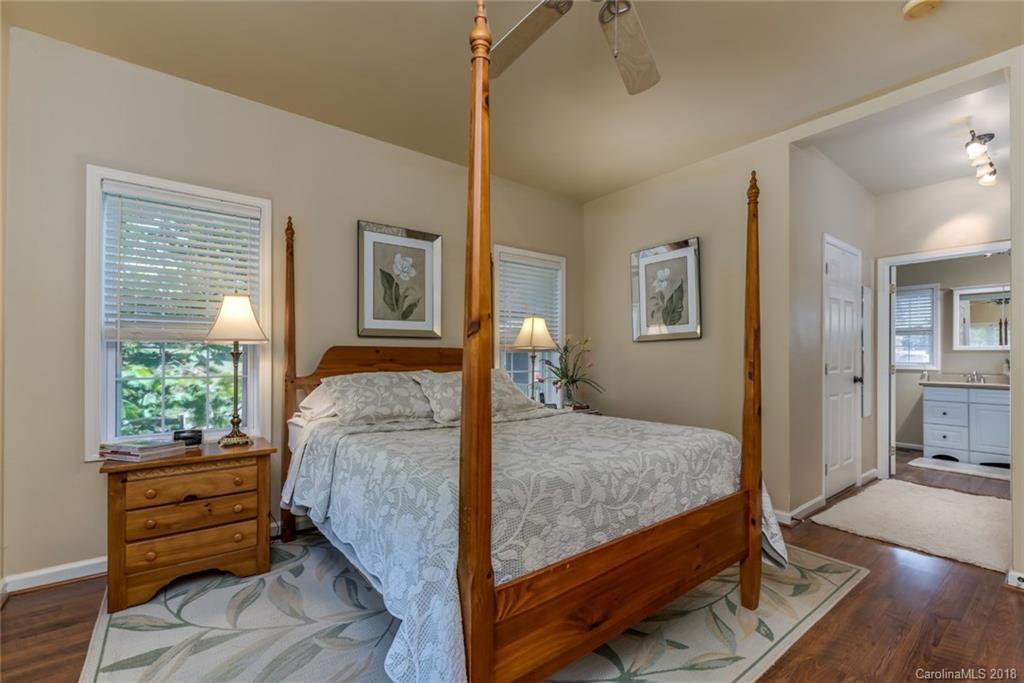 1588 McEntire Road Tryon, NC 28782 - Photo 11 of 27 a bed sitting in a bedroom next to a window