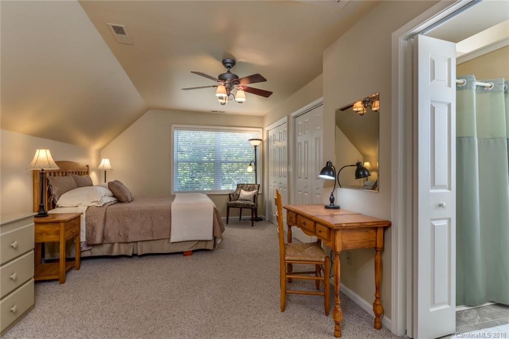 1588 McEntire Road Tryon, NC 28782 - Photo 12 of 27 a bedroom with furniture and a window