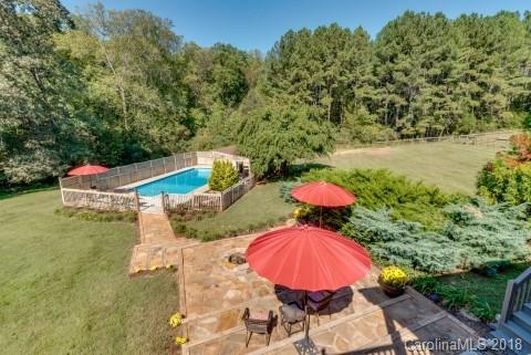 1588 McEntire Road Tryon, NC 28782 - Photo 17 of 27 a view of a swimming pool with a yard