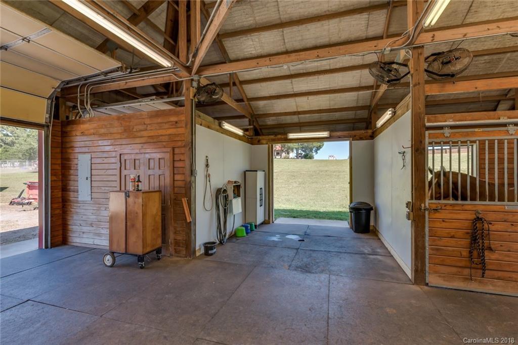 1588 McEntire Road Tryon, NC 28782 - Photo 22 of 27 a view of a hallway with wooden walls