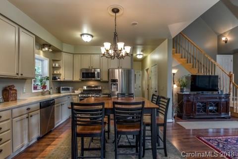 1588 McEntire Road Tryon, NC 28782 - Photo 4 of 27 a kitchen that has a table and chairs in it