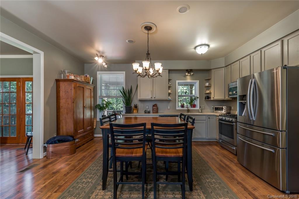 1588 McEntire Road Tryon, NC 28782 - Photo 6 of 27 a view of a dining room with furniture window and wooden floor