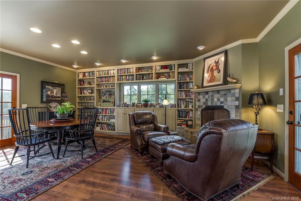 1588 McEntire Road Tryon, NC 28782 - Photo 9 of 27 a living room with furniture and a fireplace