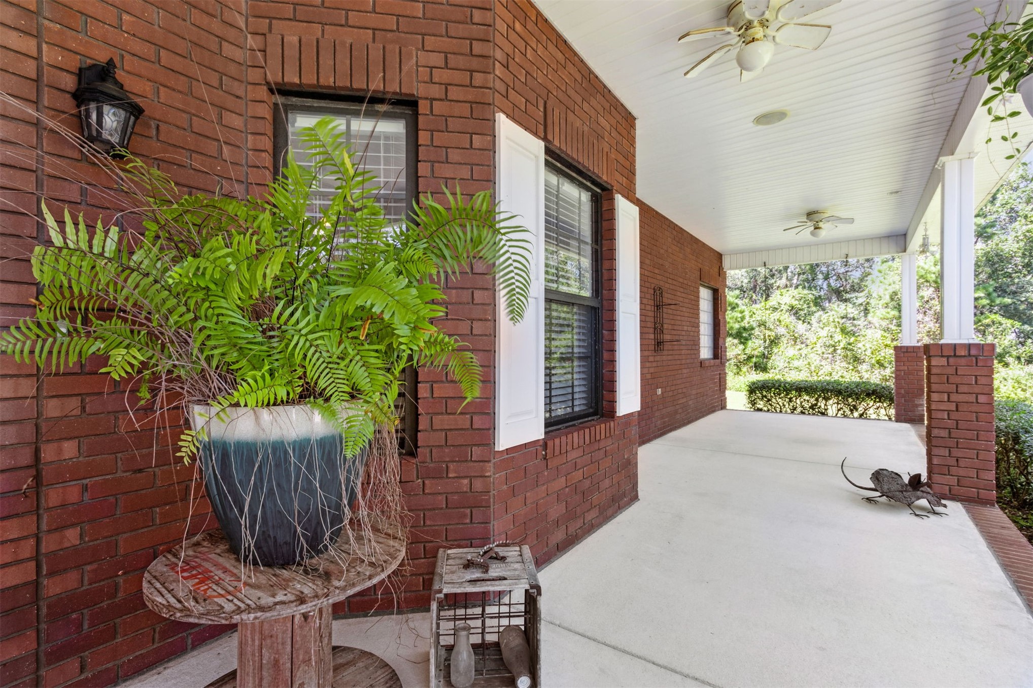 87377 Raddin Road Yulee, FL 32097 - Photo 12 of 75 a wooden bench sitting in front of a building