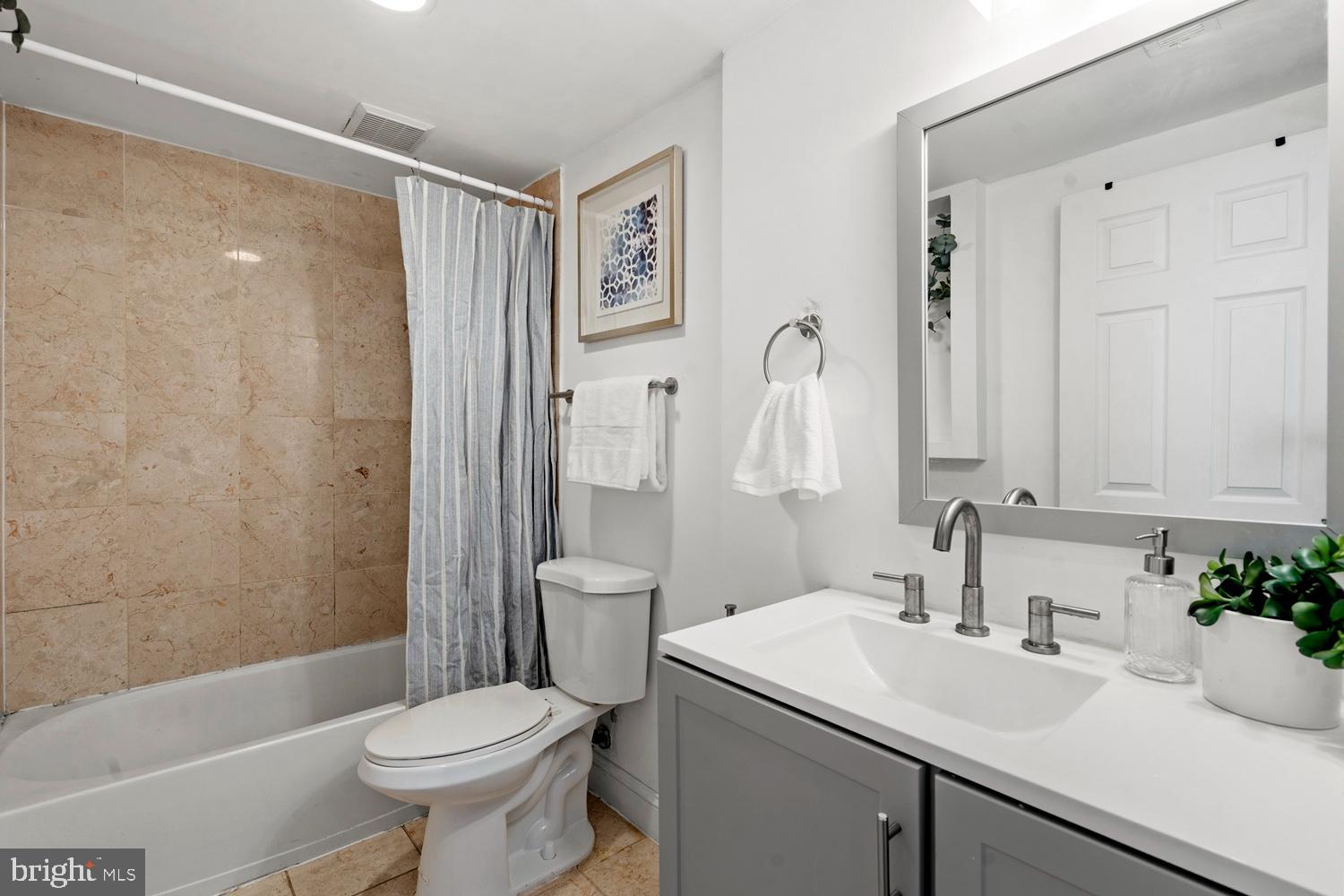 1125 12th Street Northwest, Unit 21 Washington, DC 20005 - Photo 14 of 23 a bathroom with a sink toilet and shower