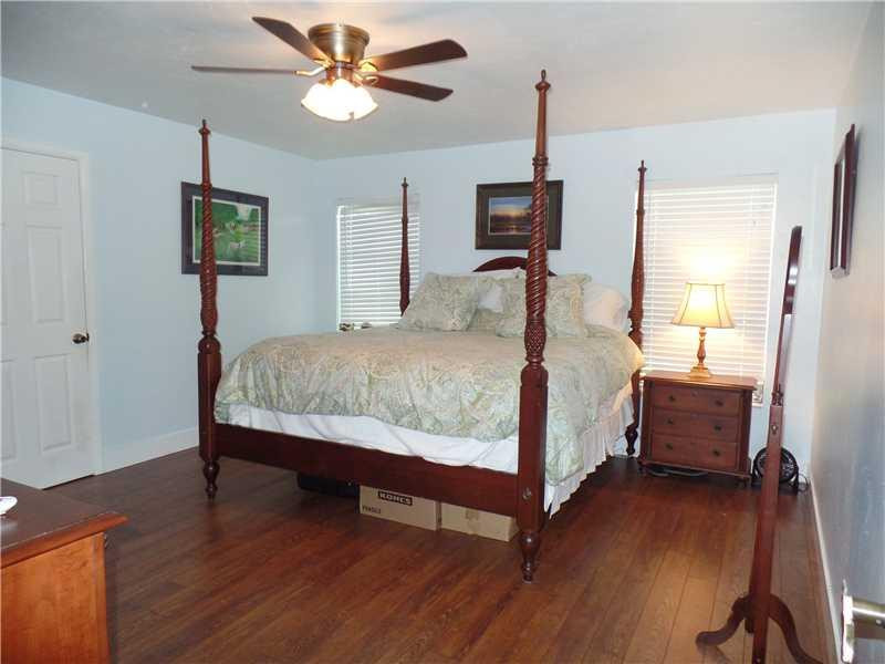 6230 Southwest 186th Way Southwest Ranches, FL 33332 - Photo 17 of 29 a bedroom with a bed and wooden floor