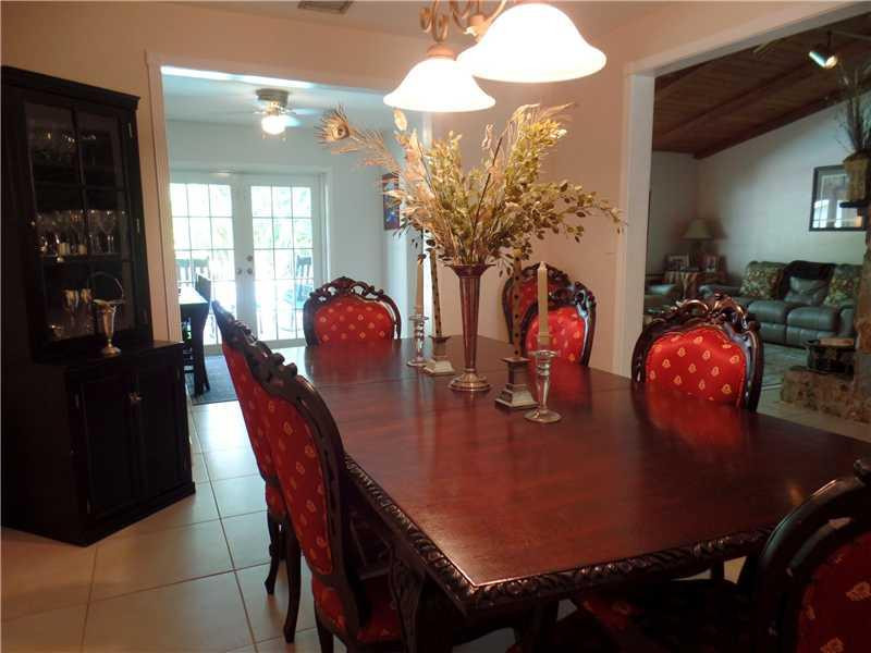6230 Southwest 186th Way Southwest Ranches, FL 33332 - Photo 10 of 29 a view of a dining room with furniture and chandelier
