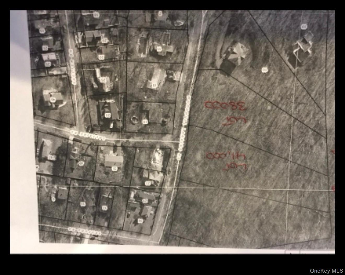 Woodhull Landing Road Miller Place, NY 11764 - Photo 2 of 2 a black and white photo of a bathroom