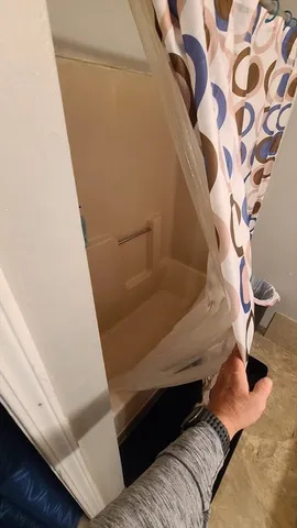 a bathroom with a sink toilet and mirror