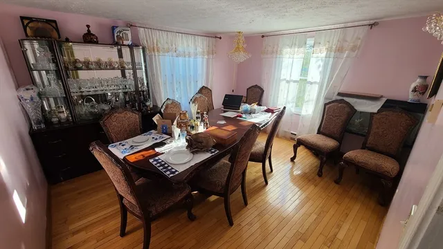 a work room with furniture and wooden floor