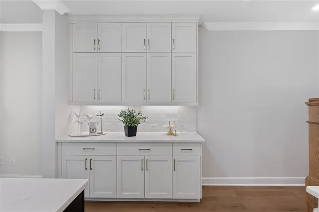 a view of cabinets with wooden floor