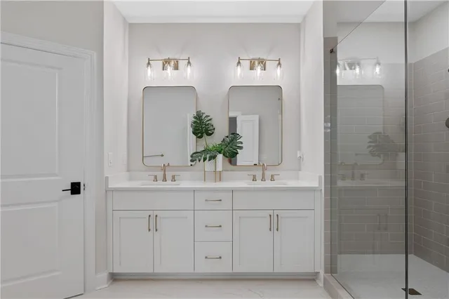 a bathroom with a double vanity sink and mirror