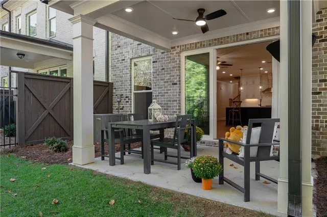 a outdoor view of a house with basket ball court