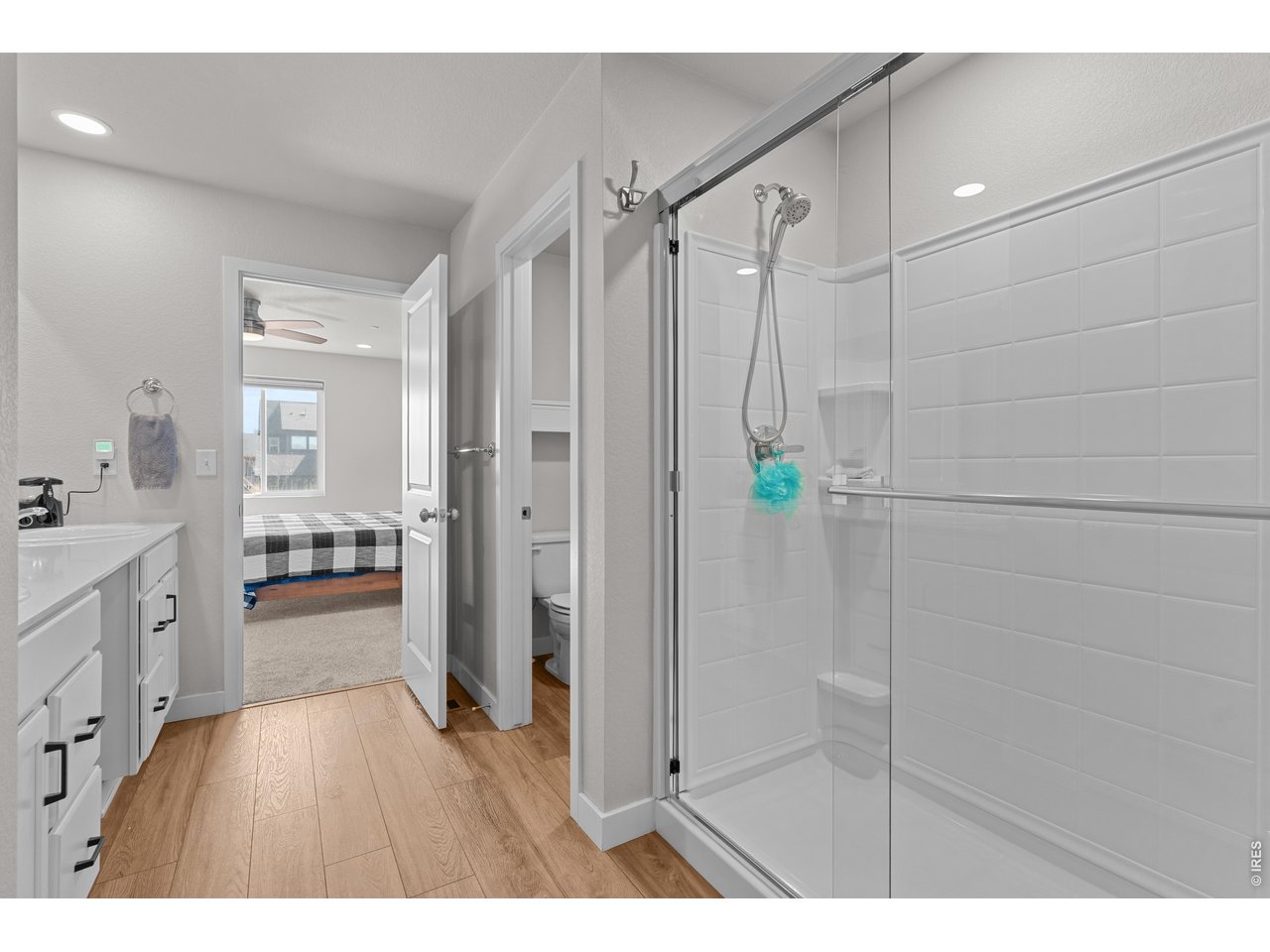 6611 4th Street, Unit 1 Greeley, CO 80634 - Photo 32 of 48 Luxury shower with detachable shower head and solid surround for low maintenance and easy cleaning.