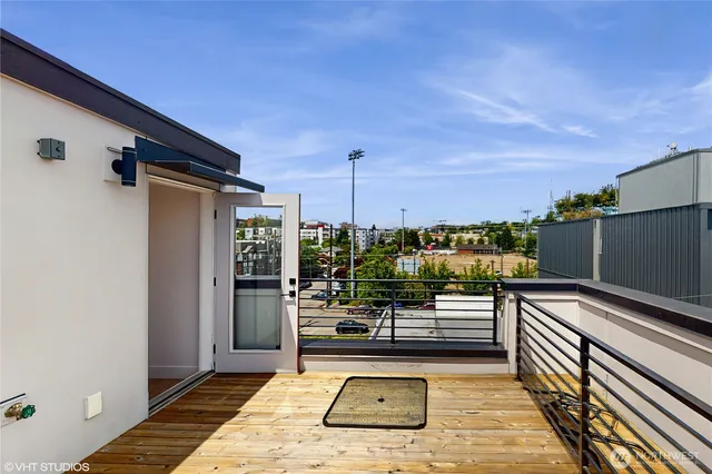 a bedroom with furniture and large window