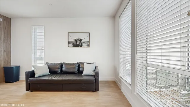 a bedroom with furniture and window