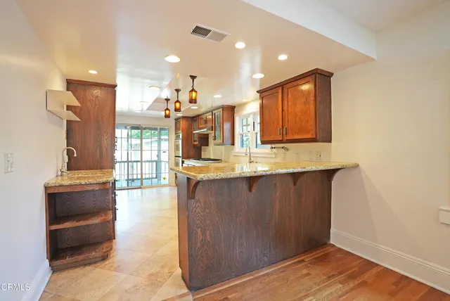 a view of a hallway with washer and dryer