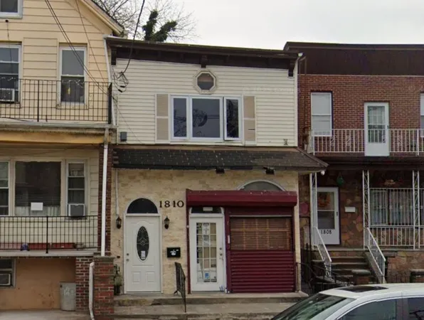 a front view of a house with a garage