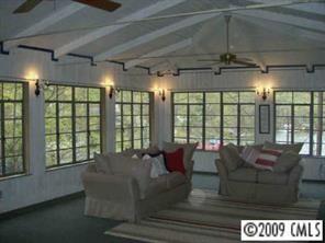 18330 Bessbrook Road Charlotte, NC 28278 - Photo 2 of 8 a living room with furniture and a floor to ceiling window