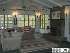 18330 Bessbrook Road Charlotte, NC 28278 - Photo 3 of 8 a living room with furniture and a fireplace